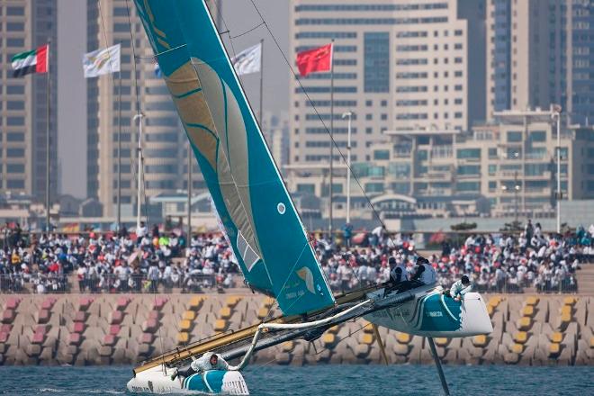 Oman Air impresses the fans in Qingdao 2012 – Oman Air flies a hull, and impresses the fans on day one in Qingdao - Extreme Sailing Series™ © Lloyd Images